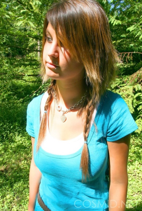Cutie Britt Phillips in pigtails removing her top to sun her big titties