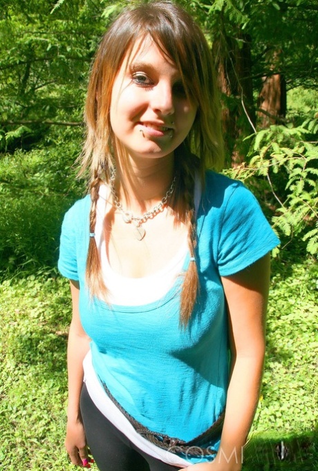 Cutie Britt Phillips in pigtails removing her top to sun her big titties
