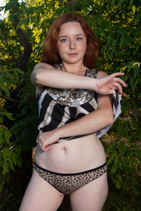 Amateur redhead Elouisa plays with her fuzzy mature pussy & big tits in nature