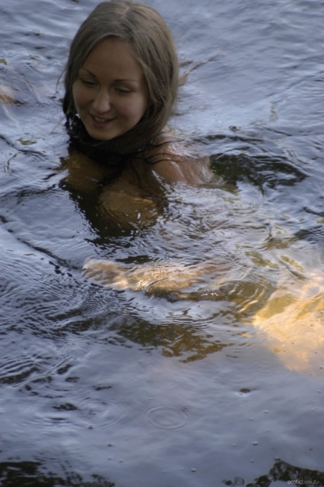 Kinky teen with nice curves Aneli A flaunts her large breasts in the river